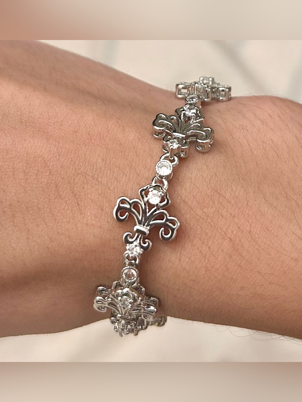 Fleur-de-Lis Link Bracelet with Clear Crystal Accents. Silver Tone